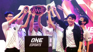 IG lifts the trophy after winning the ONE Esports Singapore Major.